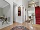 Inviting foyer featuring hardwood floors, open archways, and a view of the living area at 6772 Blantyre Boulevard Blvd, Stone Mountain, GA 30087