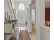 Bright and airy foyer featuring high ceilings, hardwood floors, and elegant decorative elements at 6772 Blantyre Boulevard Blvd, Stone Mountain, GA 30087