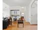Hallway with white walls and hardwood floors, featuring built-in cabinetry and an arched doorway at 6772 Blantyre Boulevard Blvd, Stone Mountain, GA 30087