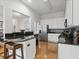 Modern kitchen with granite countertops, stainless steel appliances, and a breakfast bar at 6772 Blantyre Boulevard Blvd, Stone Mountain, GA 30087
