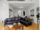 Spacious living room with hardwood floors and a view of the kitchen and dining area at 6772 Blantyre Boulevard Blvd, Stone Mountain, GA 30087