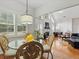 Bright dining and living area with large windows and hardwood floors at 6772 Blantyre Boulevard Blvd, Stone Mountain, GA 30087