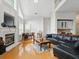 Cozy living room with fireplace, vaulted ceiling, hardwood floors and comfortable seating at 6772 Blantyre Boulevard Blvd, Stone Mountain, GA 30087