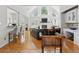 Bright living room with vaulted ceilings, large windows, fireplace, and hardwood flooring at 6772 Blantyre Boulevard Blvd, Stone Mountain, GA 30087