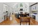 Bright living room with vaulted ceiling, fireplace, and built-in cabinetry; hardwood floors throughout at 6772 Blantyre Boulevard Blvd, Stone Mountain, GA 30087