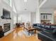 Inviting living room with fireplace, vaulted ceilings, and large windows at 6772 Blantyre Boulevard Blvd, Stone Mountain, GA 30087