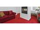Sitting area in the main bedroom with a red sofa in front of a double sided fireplace at 6772 Blantyre Boulevard Blvd, Stone Mountain, GA 30087