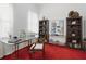 Home office with floor to ceiling bookshelves and a glass top desk with elegant decor at 6772 Blantyre Boulevard Blvd, Stone Mountain, GA 30087