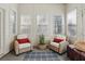 Cozy sun room featuring natural light, comfortable seating, and charming decor for relaxation at 6772 Blantyre Boulevard Blvd, Stone Mountain, GA 30087