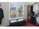 Walk-in closet with double windows for natural light; houses clothing and other personal items at 6772 Blantyre Boulevard Blvd, Stone Mountain, GA 30087