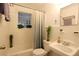 Bathroom with white tile, retro glass block window, and shower-tub combination at 819 Durant Ne # 819-6, Atlanta, GA 30308