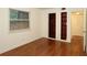 Bedroom with hardwood floors, built in shelving, and natural light from a window at 819 Durant Ne # 819-6, Atlanta, GA 30308