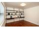 Bedroom with hardwood floors, and a built-in shelving and desk unit at 819 Durant Ne # 819-6, Atlanta, GA 30308