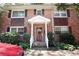Charming brick townhouse with a covered entryway and well-maintained landscaping at 819 Durant Ne # 819-6, Atlanta, GA 30308