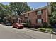 Brick apartment building featuring lush landscaping, large trees and convenient parking spaces at 819 Durant Ne # 819-6, Atlanta, GA 30308