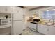 Bright kitchen featuring white cabinets, modern appliances, and patterned flooring at 819 Durant Ne # 819-6, Atlanta, GA 30308