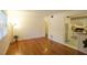 Spacious living room with hardwood floors, a large window, and seamless access to the kitchen at 819 Durant Ne # 819-6, Atlanta, GA 30308