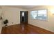 Bright, naturally lit living room features hardwood floors, white walls and a large window at 819 Durant Ne # 819-6, Atlanta, GA 30308