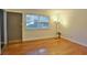 View of living room showing hardwood floors, and a large window bringing in light at 819 Durant Ne # 819-6, Atlanta, GA 30308