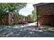 Brick condo buildings featuring mature trees and covered parking spaces at 819 Durant Ne Pl # 819-6, Atlanta, GA 30308
