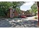 A view of the brick condo buildings with mature trees and landscaping at 819 Durant Ne Pl # 819-6, Atlanta, GA 30308