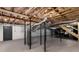 Unfinished basement featuring exposed ceiling, structural support beams, stairs, and utility connections at 1055 Delmont Ter, Roswell, GA 30075