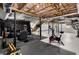 Spacious basement with workout area, recreation space, and stairs leading to the main floor at 1055 Delmont Ter, Roswell, GA 30075
