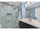 Elegant bathroom with a glass-enclosed shower, modern vanity, and stylish tile work at 1055 Delmont Ter, Roswell, GA 30075
