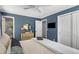 Bedroom showcasing hardwood floors, large closet, and en-suite bathroom at 1055 Delmont Ter, Roswell, GA 30075