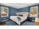 Comfortable bedroom features neutral walls, hardwood floors, and ample natural light at 1055 Delmont Ter, Roswell, GA 30075