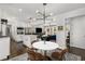 Bright, open kitchen features stainless steel appliances, an island, and an adjacent breakfast nook with seating at 1055 Delmont Ter, Roswell, GA 30075