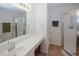 Neutral bathroom features a glass-enclosed shower and a long vanity with countertop space at 2191 Rockbridge Rd # 103, Stone Mountain, GA 30087