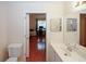 Well-lit bathroom connected to an office space with a sink, mirror, and ample countertop at 2191 Rockbridge Rd # 103, Stone Mountain, GA 30087
