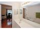 Bright bathroom connected to an office space with a sink, mirror, toilet, and countertop at 2191 Rockbridge Rd # 103, Stone Mountain, GA 30087