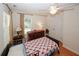 Comfortable bedroom with wood floors, a ceiling fan, and lots of natural light at 2191 Rockbridge Rd # 103, Stone Mountain, GA 30087