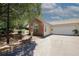 A home featuring an attached garage, brick accents, and manicured landscaping at 2191 Rockbridge Rd # 103, Stone Mountain, GA 30087