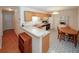 Inviting kitchen and dining area with oak cabinets and modern appliances at 2191 Rockbridge Rd # 103, Stone Mountain, GA 30087