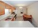 Bright eat-in kitchen with oak cabinets, modern appliances, and decorative flooring at 2191 Rockbridge Rd # 103, Stone Mountain, GA 30087