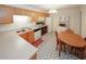 Bright kitchen with modern appliances, oak cabinets and patterned flooring at 2191 Rockbridge Rd # 103, Stone Mountain, GA 30087
