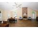 Spacious living room with a stone fireplace, high ceilings, wood floor, and lots of natural light at 2191 Rockbridge Rd # 103, Stone Mountain, GA 30087