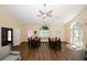 A vibrant living room and dining area featuring vaulted ceilings and wood flooring at 2191 Rockbridge Rd # 103, Stone Mountain, GA 30087