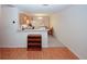 Cozy kitchen and dining area featuring oak cabinets and unique flooring design at 2191 Rockbridge Rd # 103, Stone Mountain, GA 30087