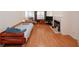 Bright living room featuring hardwood floors, fireplace, and neutral walls at 2191 Rockbridge Rd # 103, Stone Mountain, GA 30087