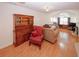 Spacious living room with vaulted ceiling, hardwood floors, and classic furnishings at 2191 Rockbridge Rd # 103, Stone Mountain, GA 30087