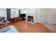 Well-lit living room featuring hardwood floors, fireplace, and neutral walls at 2191 Rockbridge Rd # 103, Stone Mountain, GA 30087