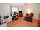 Versatile space for an office or den features wood floors and good natural light at 2191 Rockbridge Rd # 103, Stone Mountain, GA 30087