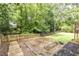 The backyard has a garden bed and a grass area, perfect for gardening and enjoying outdoor activities at 3707 Dunwoody Club Dr, Atlanta, GA 30350