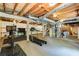 Unfinished basement with exposed ceiling, perfect for a workout space or additional storage at 3707 Dunwoody Club Dr, Atlanta, GA 30350