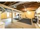 Unfinished basement with exposed ceiling, work out equipment, and exterior access at 3707 Dunwoody Club Dr, Atlanta, GA 30350