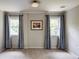 Neutral bedroom with two windows and blue patterned curtains at 3707 Dunwoody Club Dr, Atlanta, GA 30350